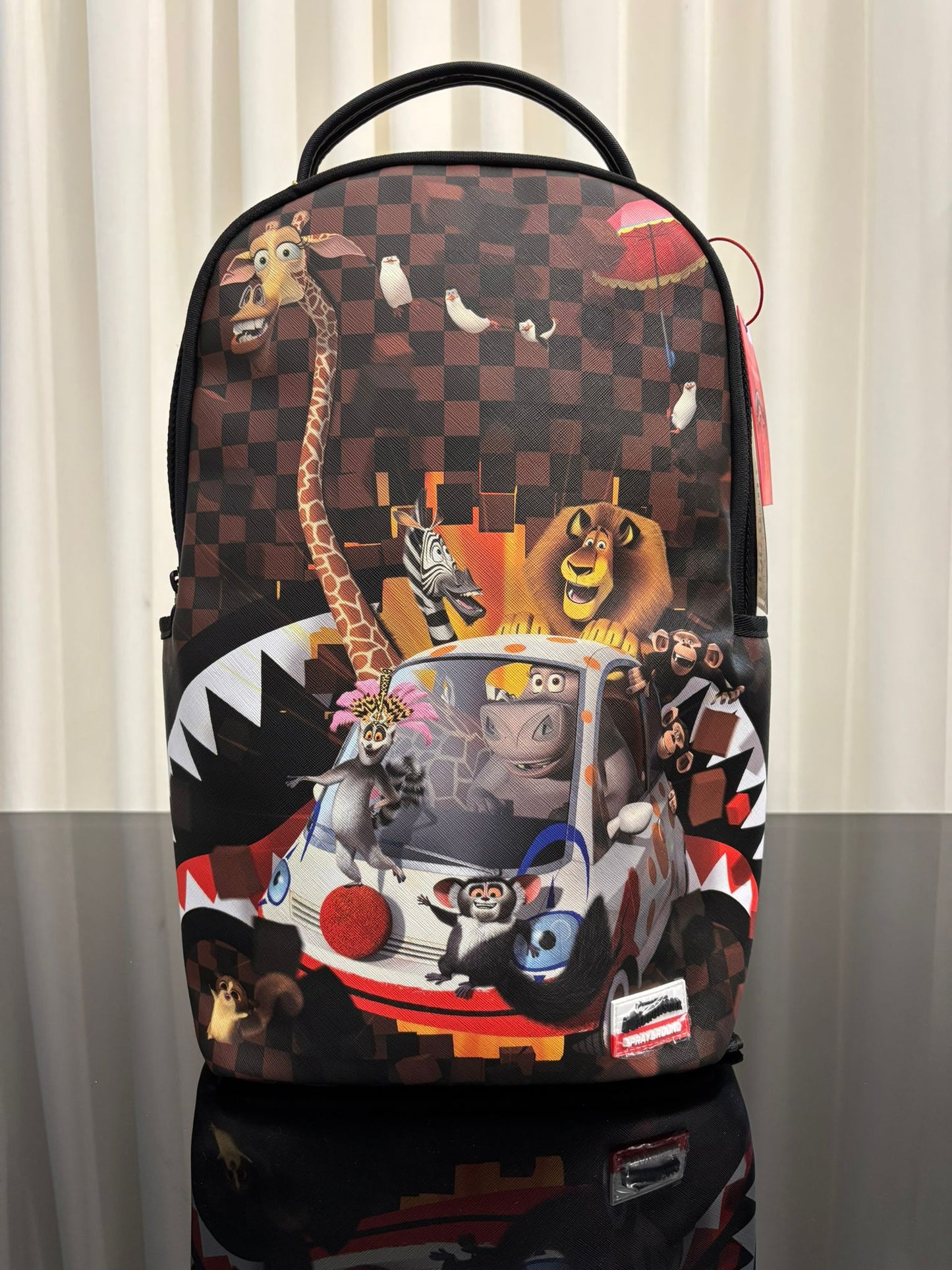 MADAGASCAR CHECKER SMASH DLXSV BACKPACK SPRAYGROUND