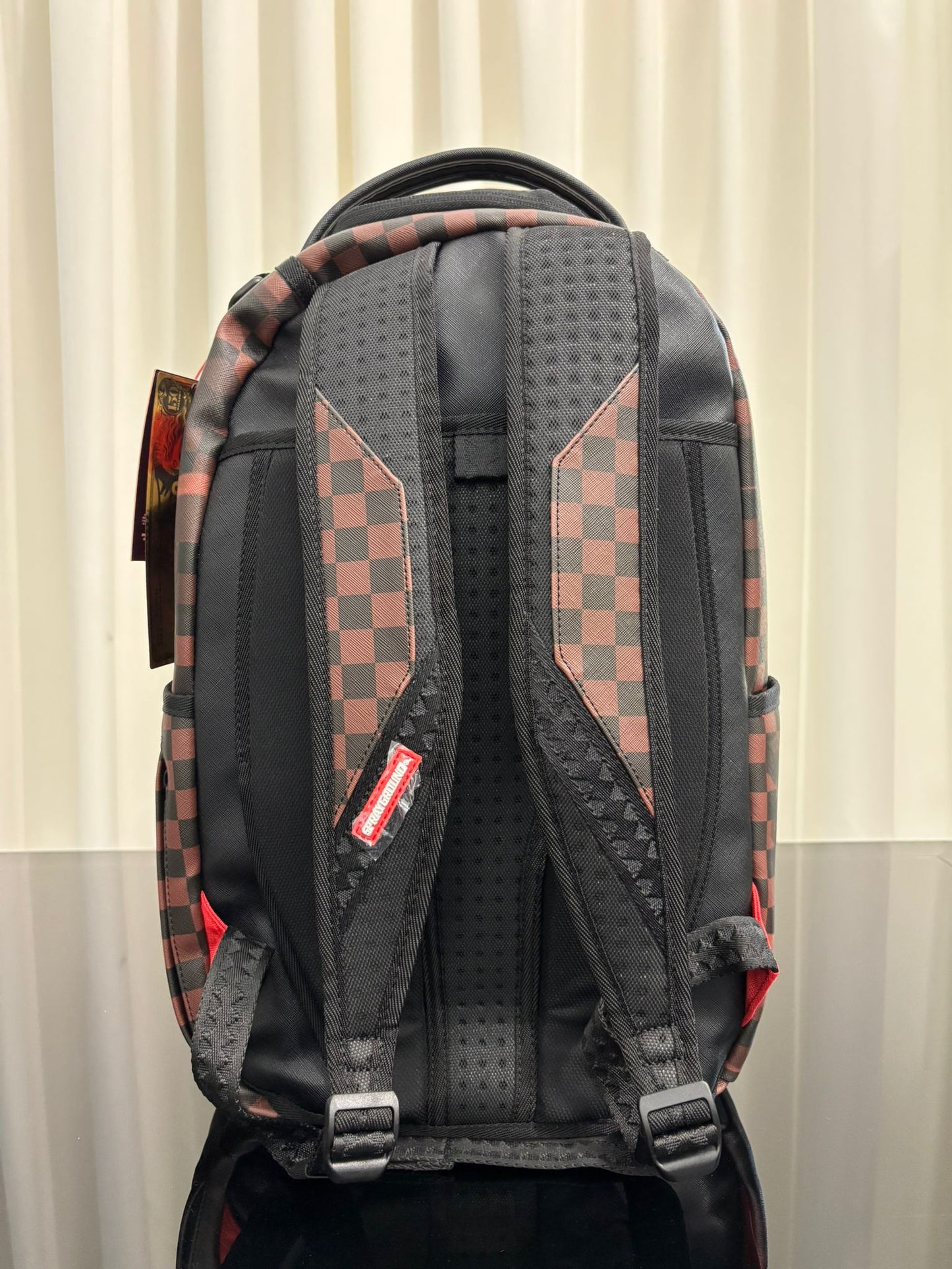 MADAGASCAR CHECKER SMASH DLXSV BACKPACK SPRAYGROUND