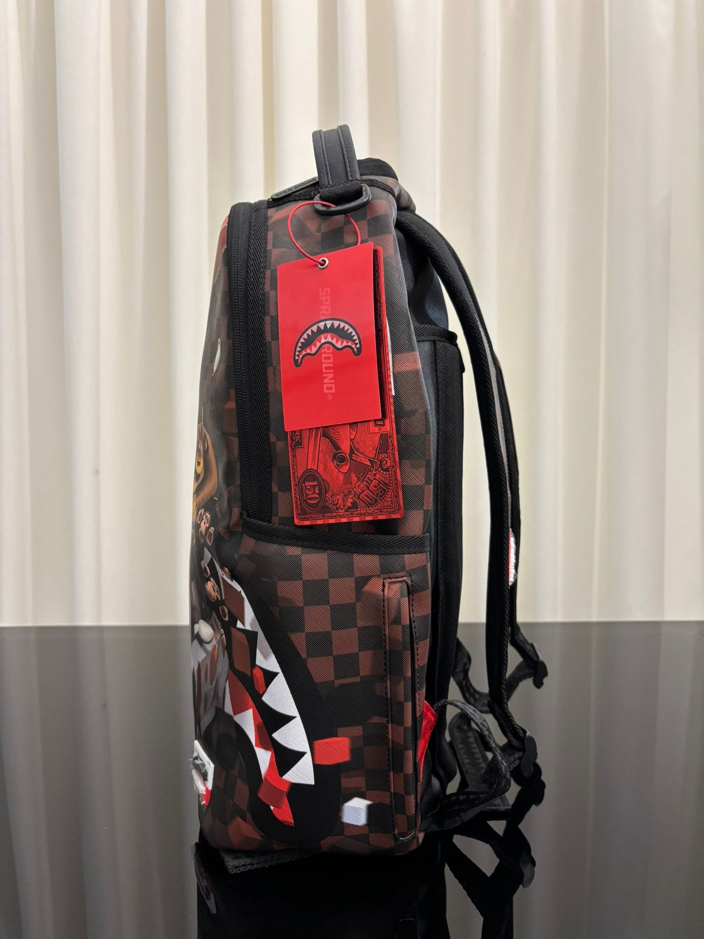 MADAGASCAR CHECKER SMASH DLXSV BACKPACK SPRAYGROUND