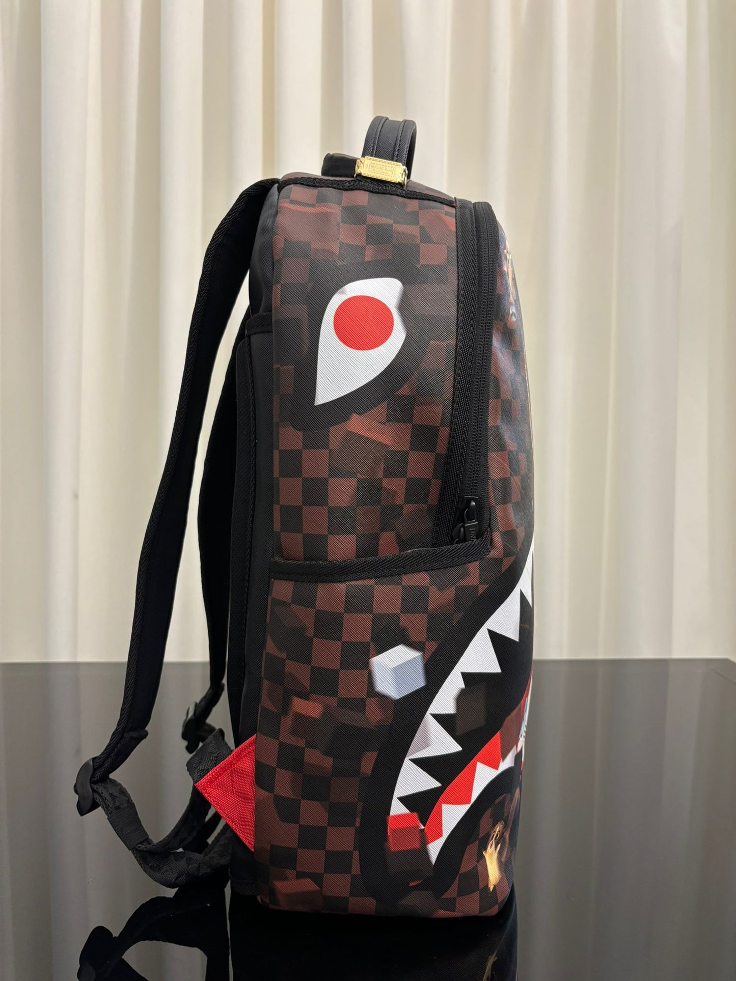 MADAGASCAR CHECKER SMASH DLXSV BACKPACK SPRAYGROUND
